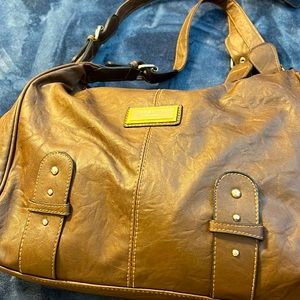Brown handbag. Like new. No evidence of wear.